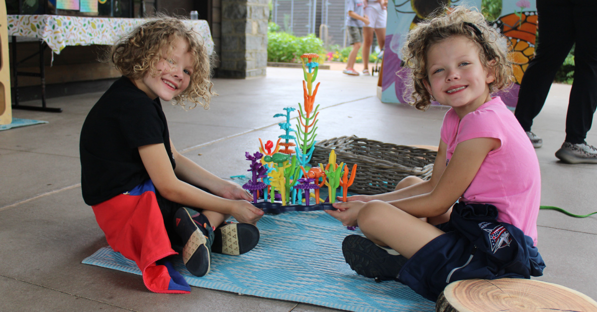 students playing with marine toy set